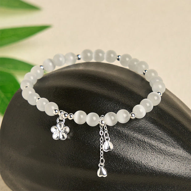 FREE Today: Peace and Love Natural Cat's Eye Cherry Blossom Bracelet - image 1