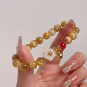 Buddha Stones Natural Golden Tiger Eye Bell Flower Courage Bracelet - image 1