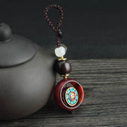 Buddha Stones Ebony Wood Sanskrit Four-leaf Clover Buddha's Eye Peace Rotatable Key Chain - Sanskrit Pattern - image 0