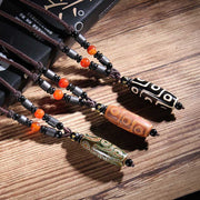 Buddha Stones Tibetan Nine-Eye Dzi Bead Wealth Necklaces & Pendants (Extra 35% Off | USE CODE: FS35) - image 0