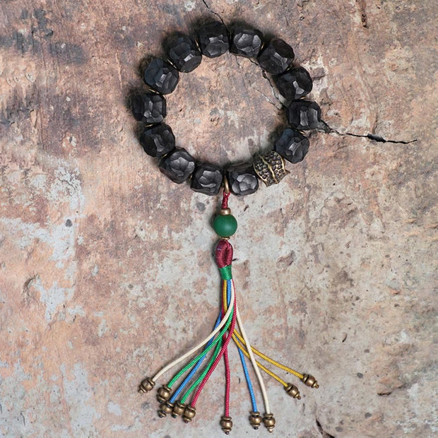 Buddha Stones Tibet Ebony Wood Copper Peace Tassel Wrist Mala Bracelet