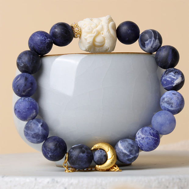 Buddha Stones Sodalite Ivory Fruit Dancing Lion Crescent Moon Harmony Bracelet